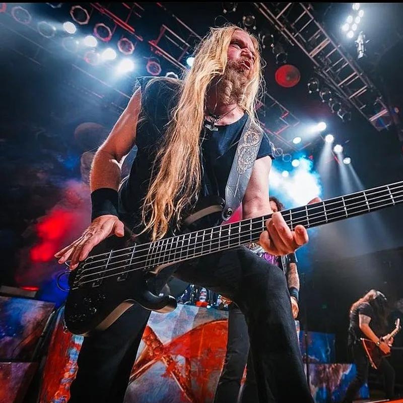 photo of bass player performing with his bass