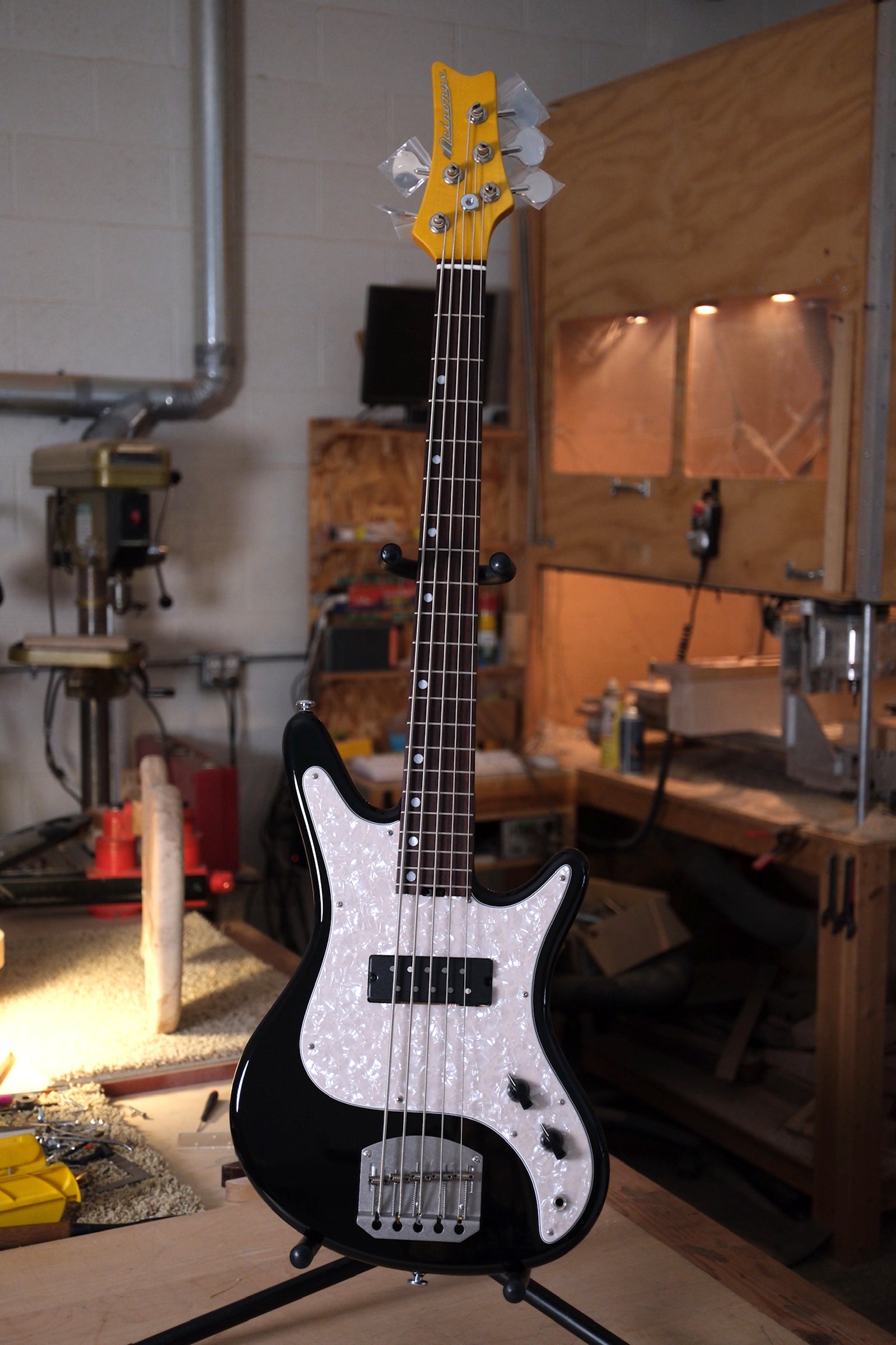 full instrument photo of the Acinonyx V Short Scale Bass Guitar - Black shot in the workshop