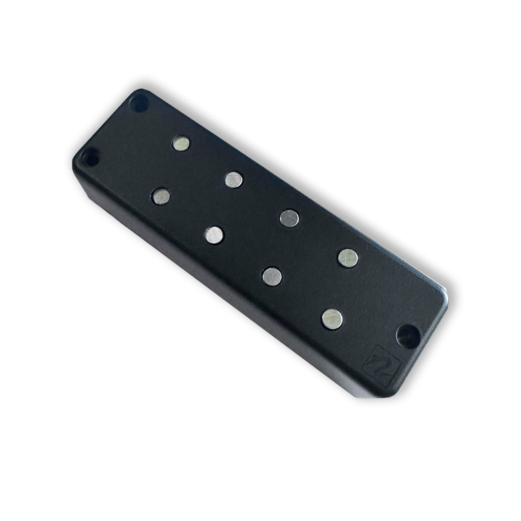 Top view of he Nordstrand PolyVox 4 Soapbar Bass Pickup, showing 2 poles per string