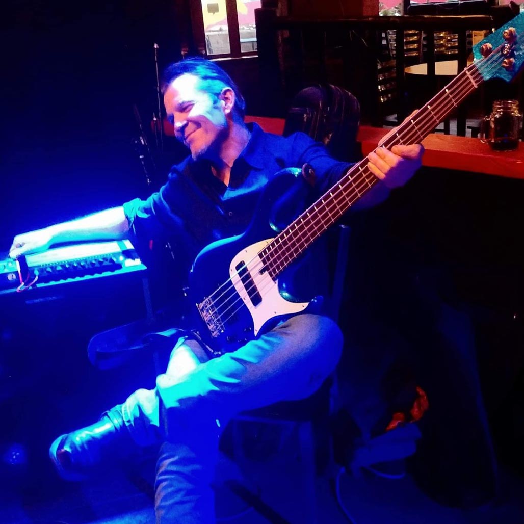 photo of bass player and his bass