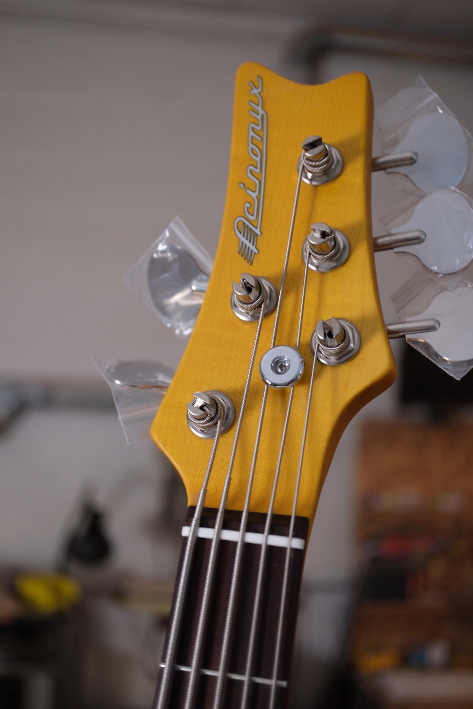 photo of the front of the headstock of the Acinonyx V Short Scale Bass Guitar - Black showing the 2x3 headstock layout