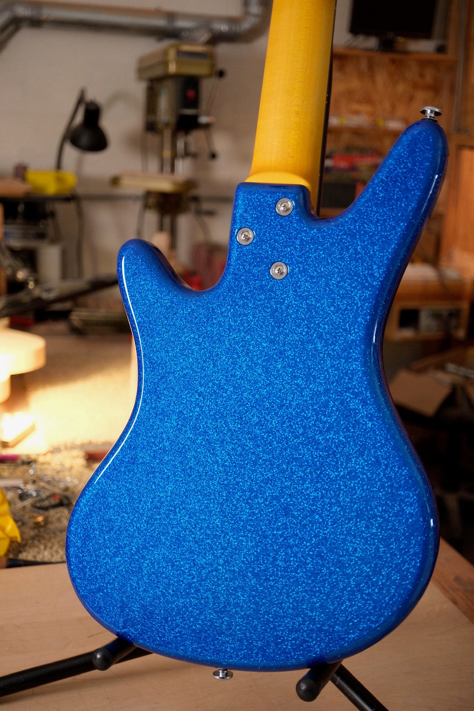 image of the Acinonyx V Short Scale Bass Guitar - Championship Sparkle Blue showing the neck heel