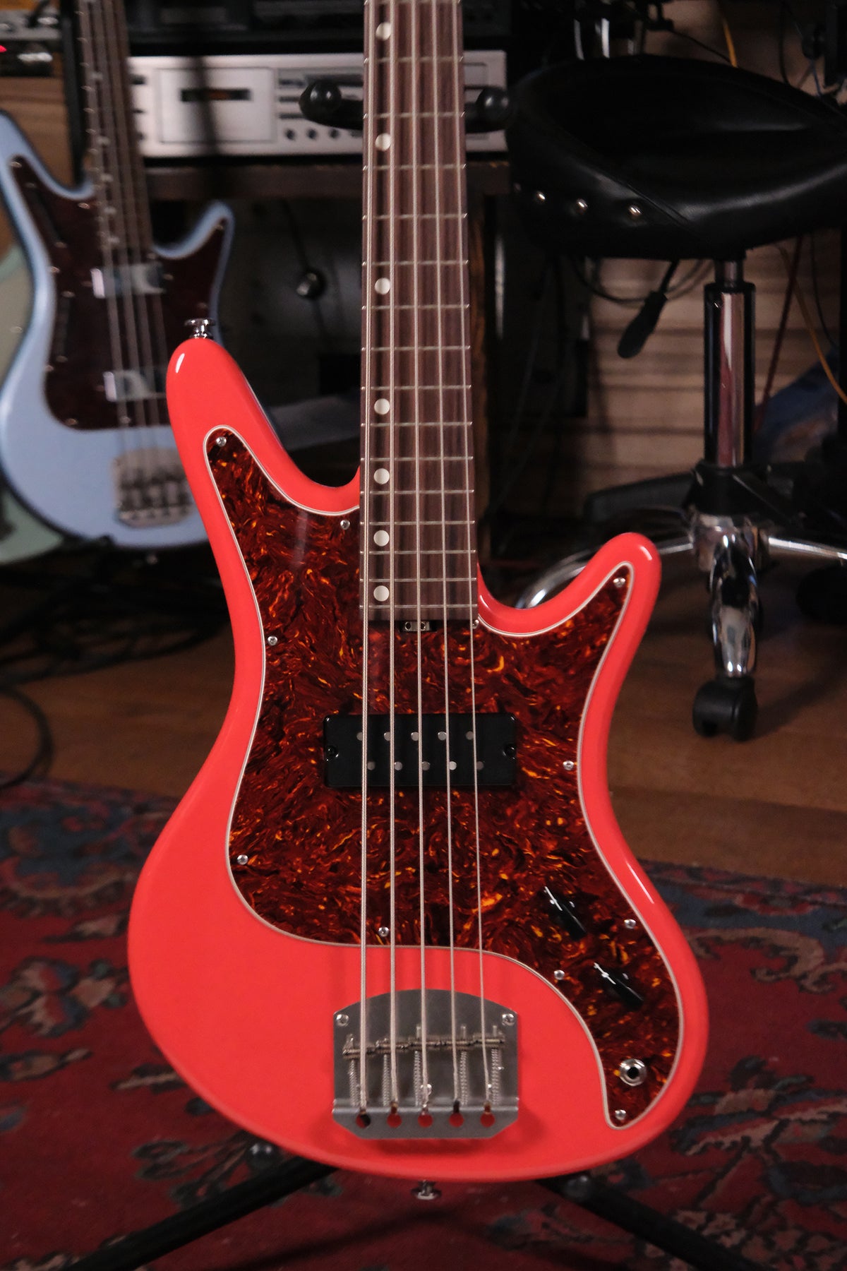 Front view of the body of the Acinonyx V - Fiesta Red bass guitar