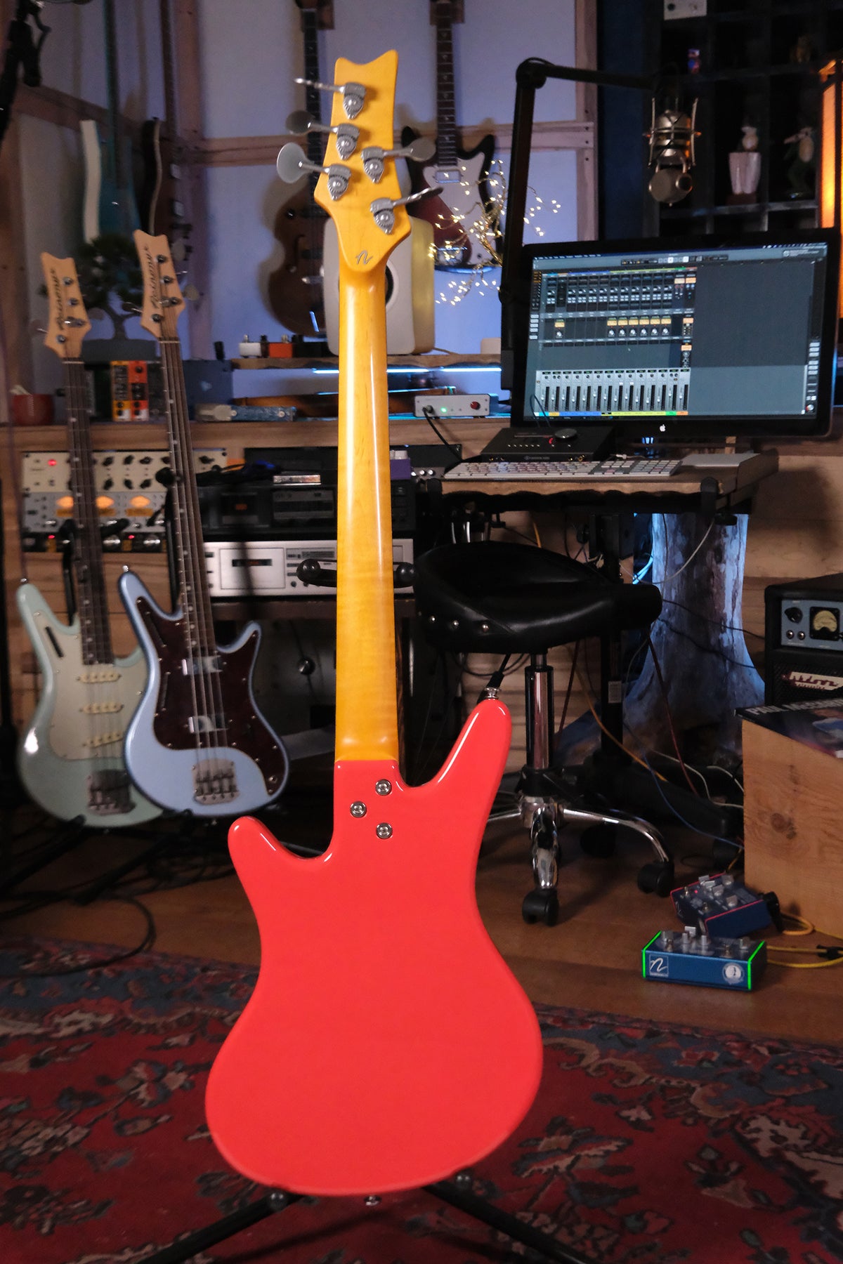 Full view of the back of the Acinonyx V - Fiesta Red bass guitar