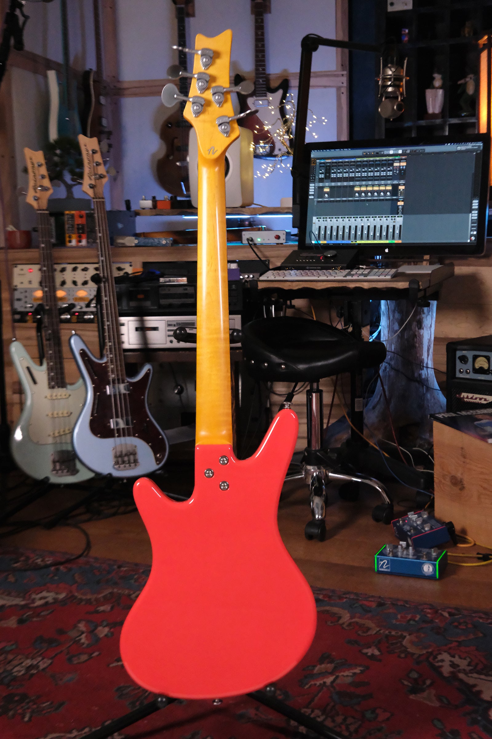 Full view of the back of the Acinonyx V - Fiesta Red bass guitar