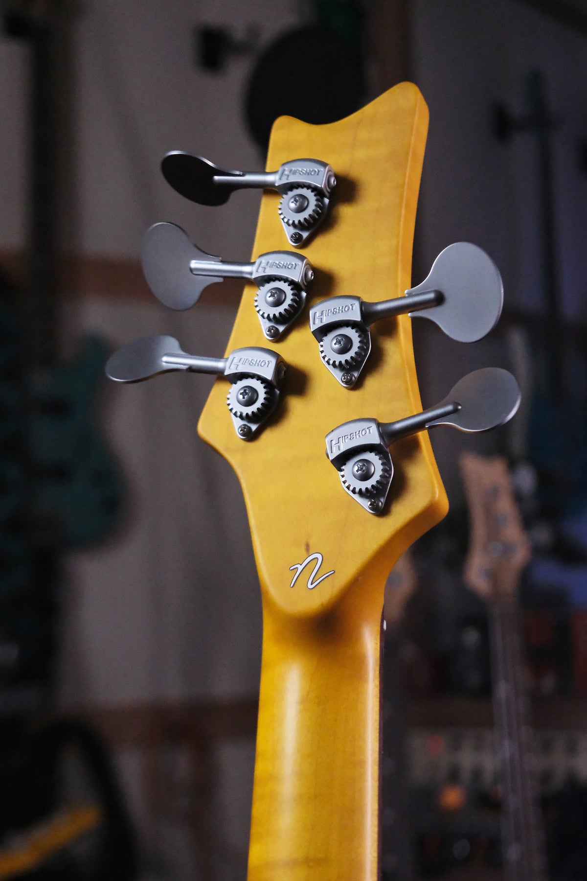 back view of the headstock on the Acinonyx V - Two Tone Burst bass guitar