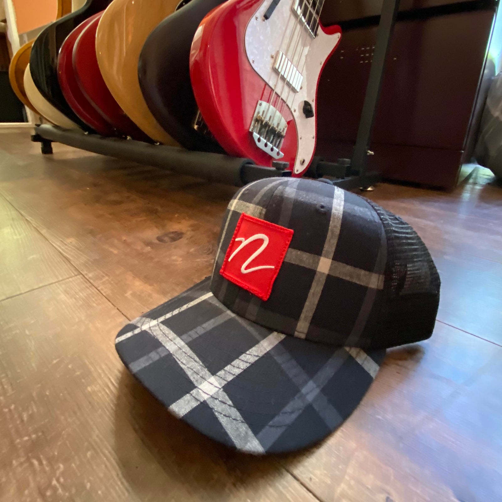 Side view of Nordstrand N Logo Plaid Trucker Cap