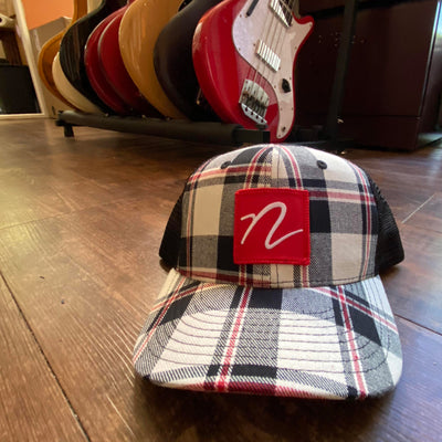 Front view of Nordstrand N Logo Plaid Trucker Cap in White and Red