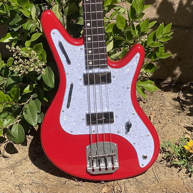 View of Pearl Pickguard on Nordstrand Acinonyx Bass In Dakota Red