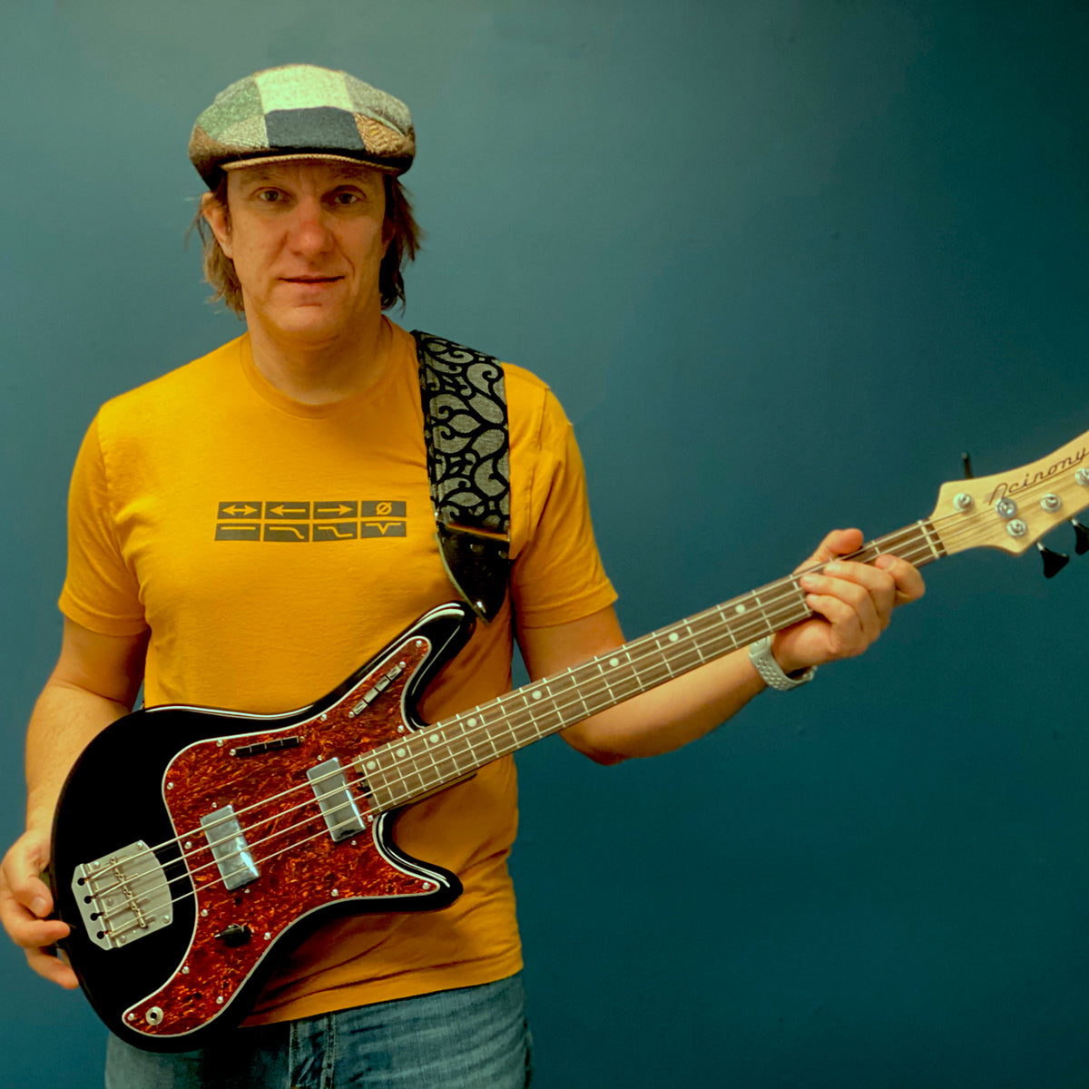 Photo of Carey Nordstand wearing Acinonyx Switches T-Shirt in yellow